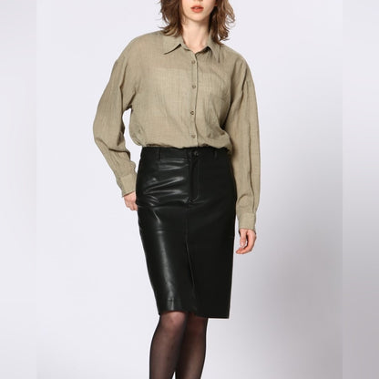 64. Soft Vegan leather skirt with a slit in the front and the back.