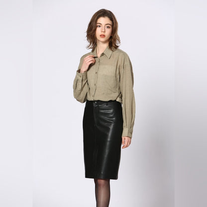 64. Soft Vegan leather skirt with a slit in the front and the back.